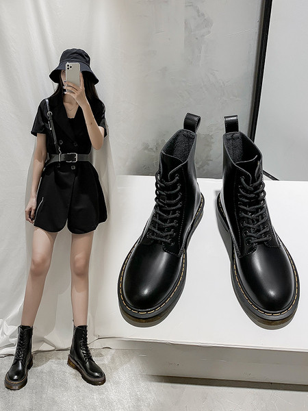 Modern bőrcsizma fűzős és cipzáras sima modell