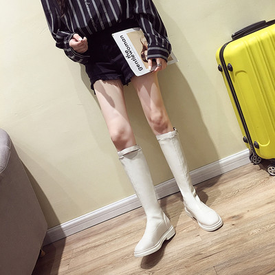 Női alkalmi csizma eko bőrből, lapos talppal, fém csattal