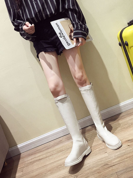 Női alkalmi csizma eko bőrből, lapos talppal, fém csattal