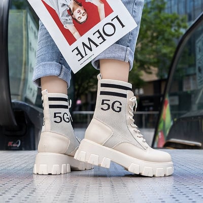 Nahast kõrge talla ja kirjadega naistesaapad