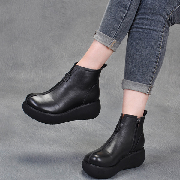 Bőr női téli csizma magas talppal