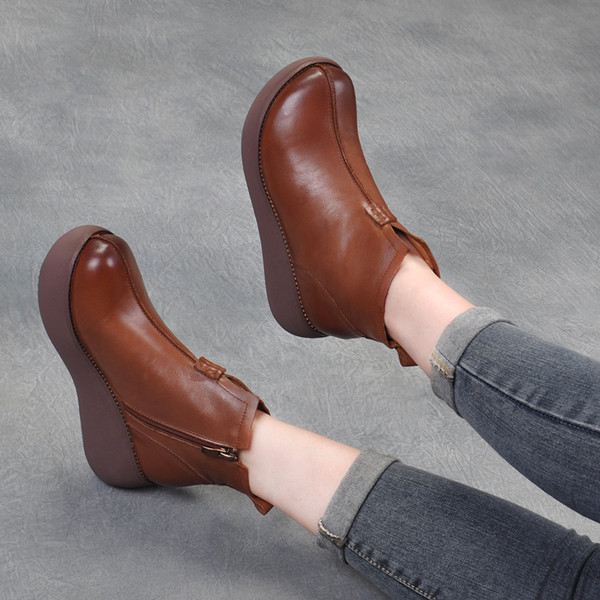 Bőr női téli csizma magas talppal