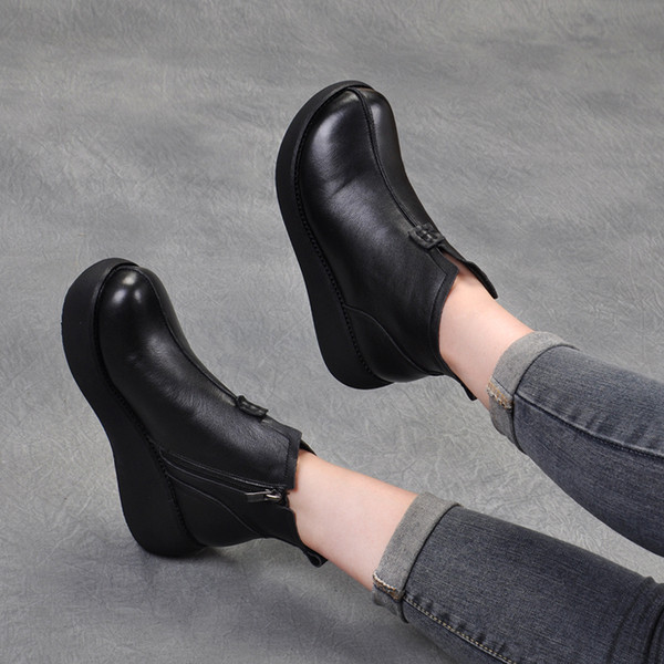 Bőr női téli csizma magas talppal