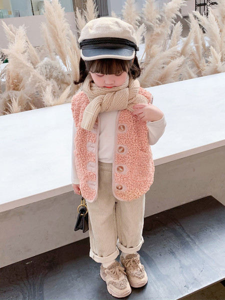 Laste nööpide ja taskutega sulevest tüdrukutele