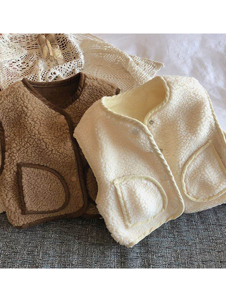 Nööpide ja taskutega sulevest tüdrukutele