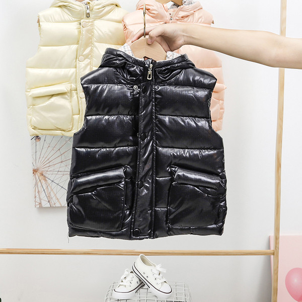 Laste sügis-talvine vest kapuutsiga ja taskutega