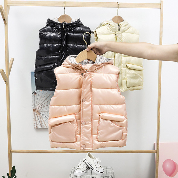 Laste sügis-talvine vest kapuutsiga ja taskutega