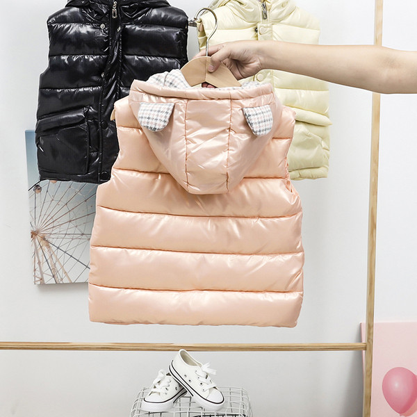 Laste sügis-talvine vest kapuutsiga ja taskutega