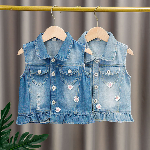 Moodne laste teksavest tüdrukutele, mille seljal on aplikatsioon