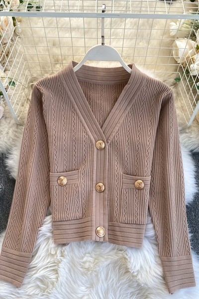 Naiste vest nööpide ja taskutega