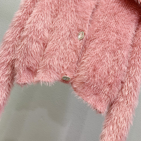 Ženska puhasta vesta na gumbe - kratki model