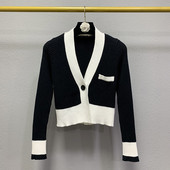 Naiste kaasaegne must-valge spitsikaelusega vest