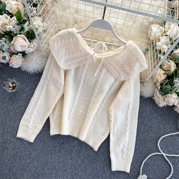 Naiste ümara dekoltee ja lipsudega kampsun