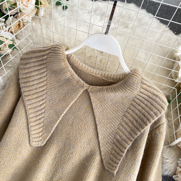 Pikk naiste kampsun ümara kaelusega ja pikkade varrukatega