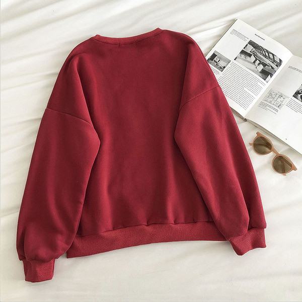 Jõuluaegne naiste kampsun tikandi ja ovaalse kaelusega