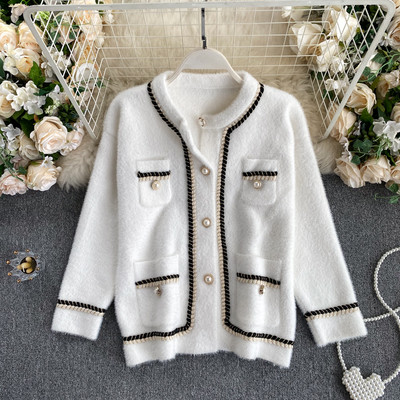 Naiste pärlite ja taskutega sulevest