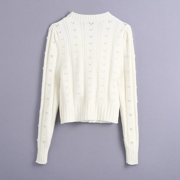 Γυναικείο πουλόβερ με πέρλεσ και βολάν