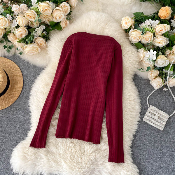 Naiste vabaaja kampsun nööpide ja ümara kaelusega