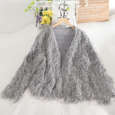 Μοντέρνα γυναικεία ζακέτα με πούλιες και φούντες