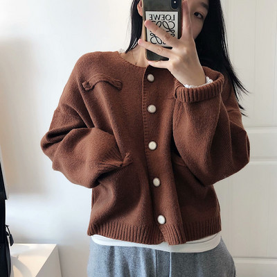 Naiste vabaajavest beeži värvi nööpide ja taskutega