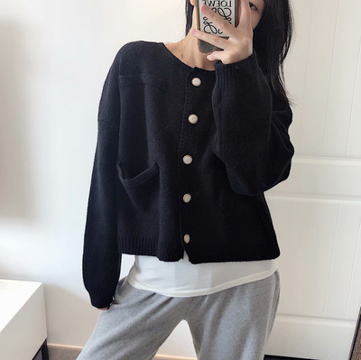 Naiste vabaajavest beeži värvi nööpide ja taskutega