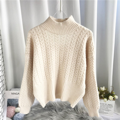 Μοντέρνο γυναικείο πουλόβερ με ψηλό γιακά και κομμένα μέρη της πλάτης