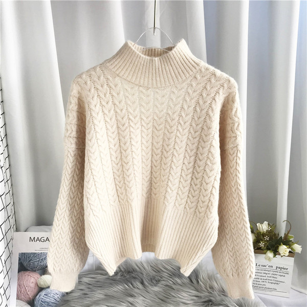 Μοντέρνο γυναικείο πουλόβερ με ψηλό γιακά και κομμένα μέρη της πλάτης