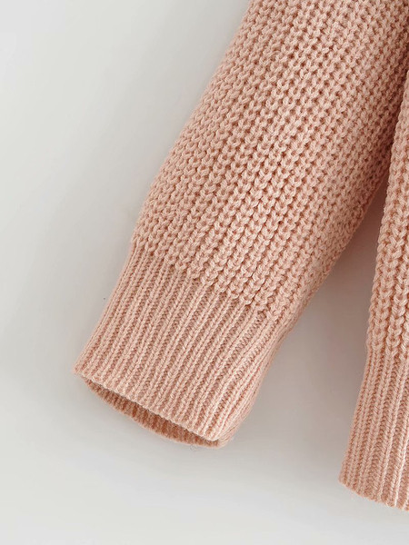 Naiste kampsun ja spits kaelus lipsudega seljal