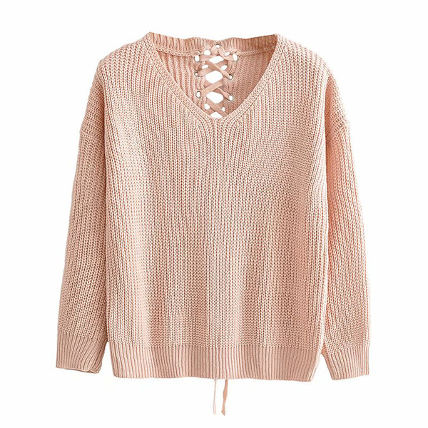 Naiste kampsun ja spits kaelus lipsudega seljal