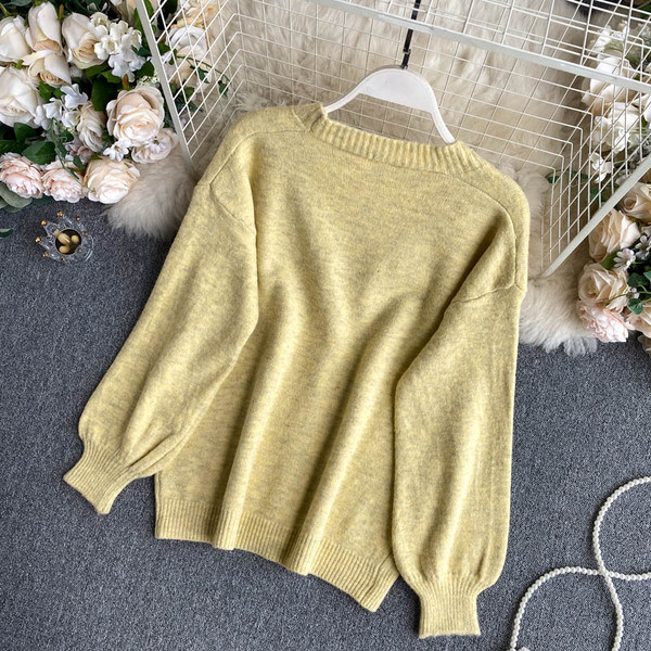 Naiste nööpide ja pikkade varrukatega sulevest