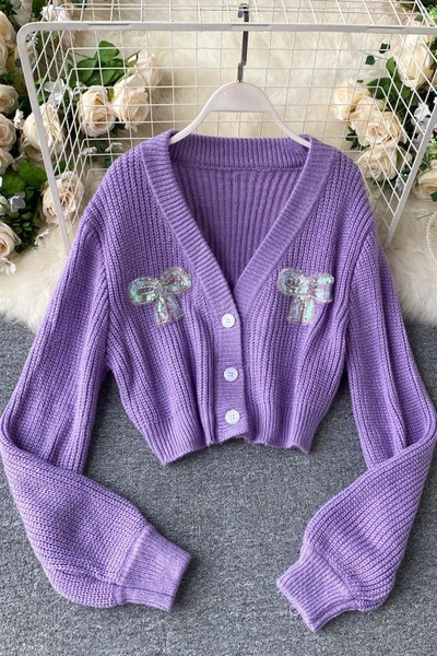 Γυναικείο πουλόβερ με μοβ χρώμα και κορδέλα με πούλιες