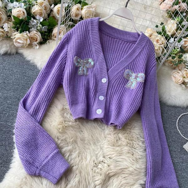 Γυναικείο πουλόβερ με μοβ χρώμα και κορδέλα με πούλιες