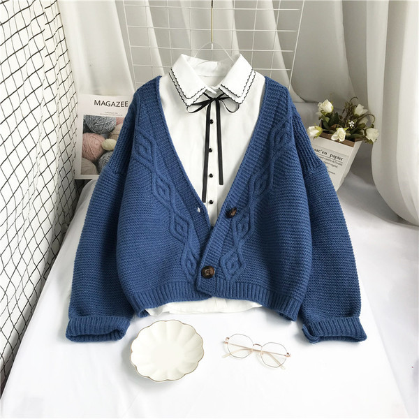 Uue mudeli naiste kootud vest nööpide ja spitsikaelusega