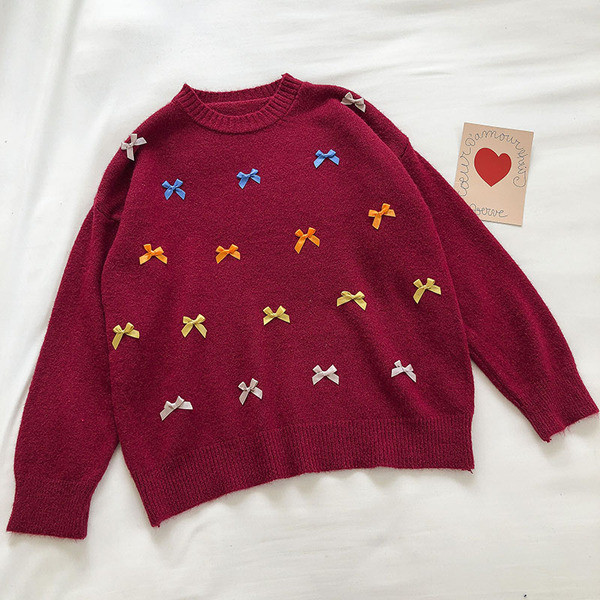 Γυναικείο χειμερινό πουλόβερ με στρογγυλή λαιμόκοψη και χρωματιστές κορδέλες