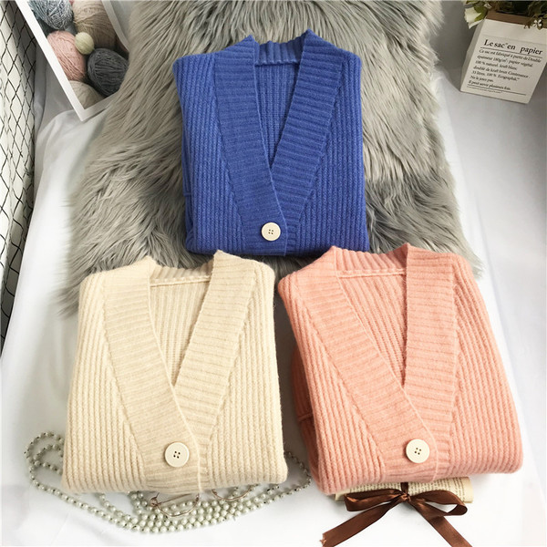 Moodne naiste vest taskute ja pikkade varrukatega