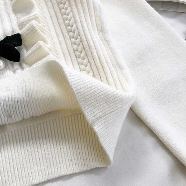 Γυναικείο πουλόβερ μοντέρνο με κορδέλες και στρογγυλή λαιμόκοψη