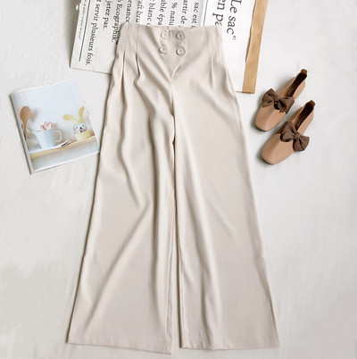 Naiste püksid kõrge vöökoha ja nööpidega lai mudel