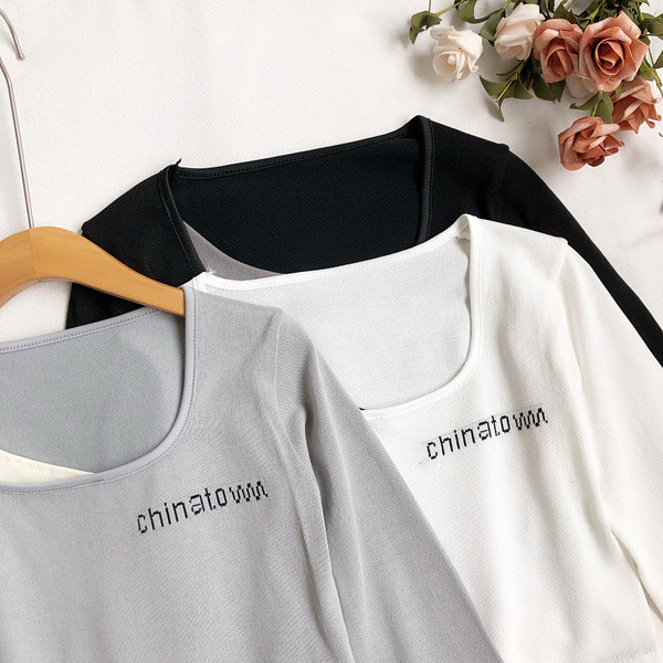 Ženska bluza s okruglim izrezom i vezom