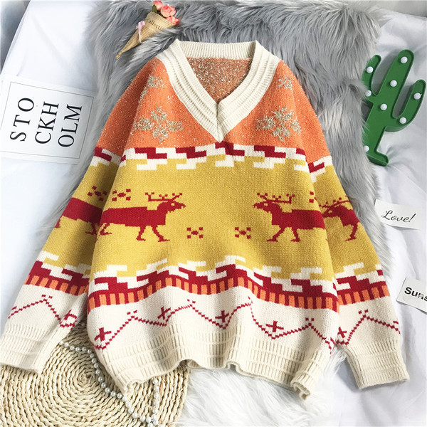 Γυναικείο λουλουδάτο πουλόβερ με φαρδιά λαιμόκοψη