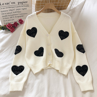 Modernus moteriškas megztinis platus modelis su sagomis