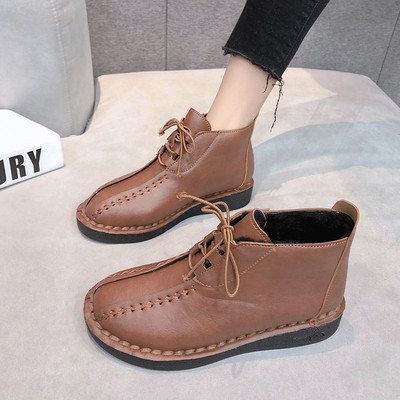 Γυναικείες μοντέρνες οικολογικές δερμάτινες μπότες με κορδόνια και επίπεδη σόλα