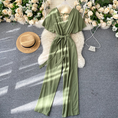 Pikk naiste kombinesoon V-kaelusega ja vöörihmaga