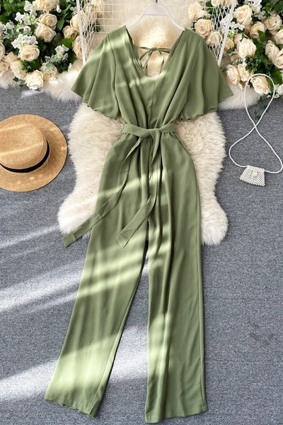 Pikk naiste kombinesoon V-kaelusega ja vöörihmaga