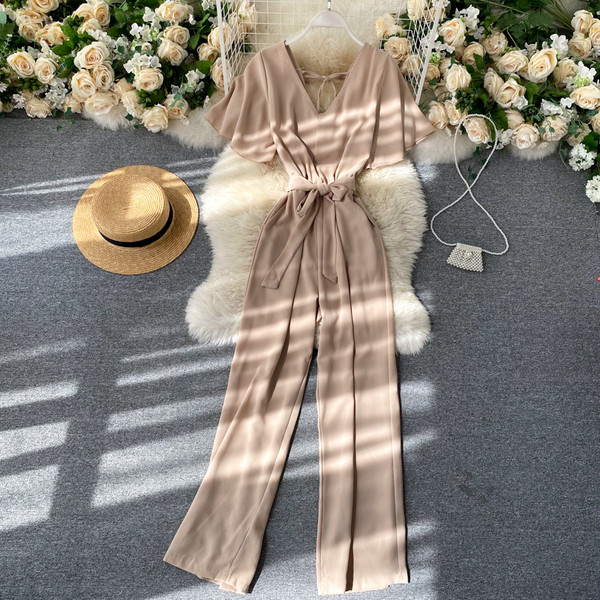 Pikk naiste kombinesoon V-kaelusega ja vöörihmaga