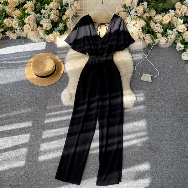 Pikk naiste kombinesoon V-kaelusega ja vöörihmaga