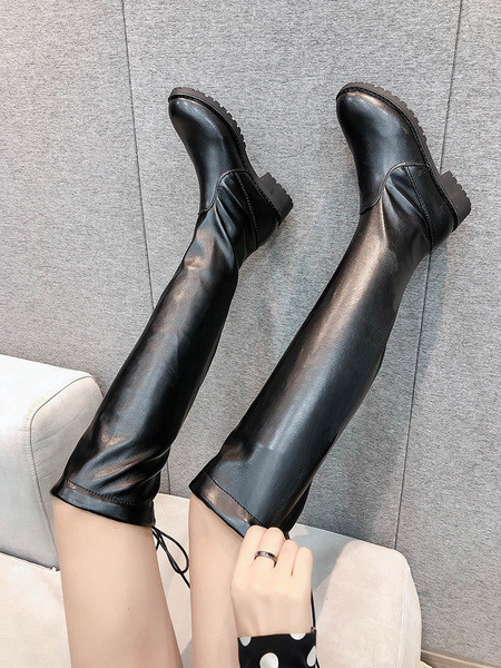 Naiste musta värvi paelte ja lameda tallaga nahast saapad