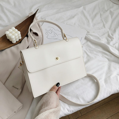 Κομψή γυναικεία έκο δερμάτινη τσάντα με κοντές και μεγάλες λαβές