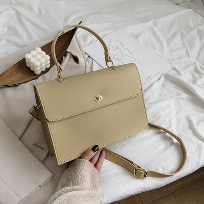 Κομψή γυναικεία έκο δερμάτινη τσάντα με κοντές και μεγάλες λαβές