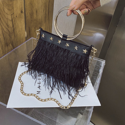 Moodne tuttide ja metallelementidega naistekott