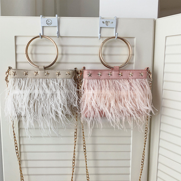 Moodne tuttide ja metallelementidega naistekott